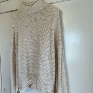 Slouchy ivory turtleneck sweater